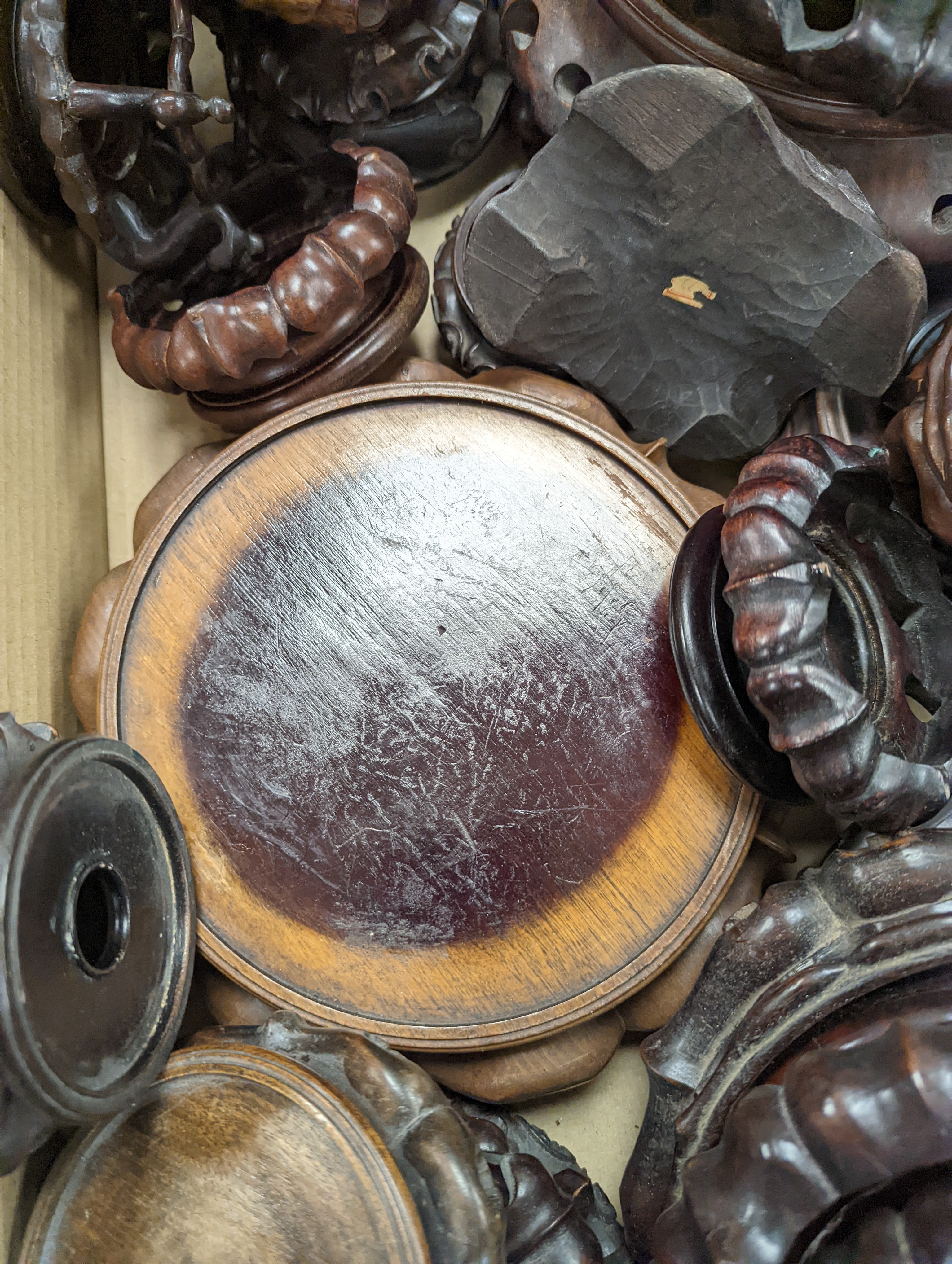 A large collection of Chinese hardwood stands.